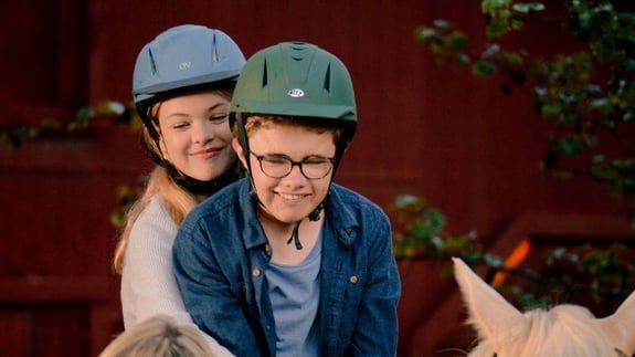 anna and michael riding the horse shadrach